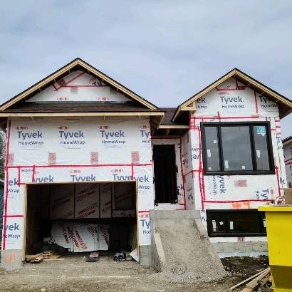 New-build home wrapped in Tyvek house wrap, ready for siding